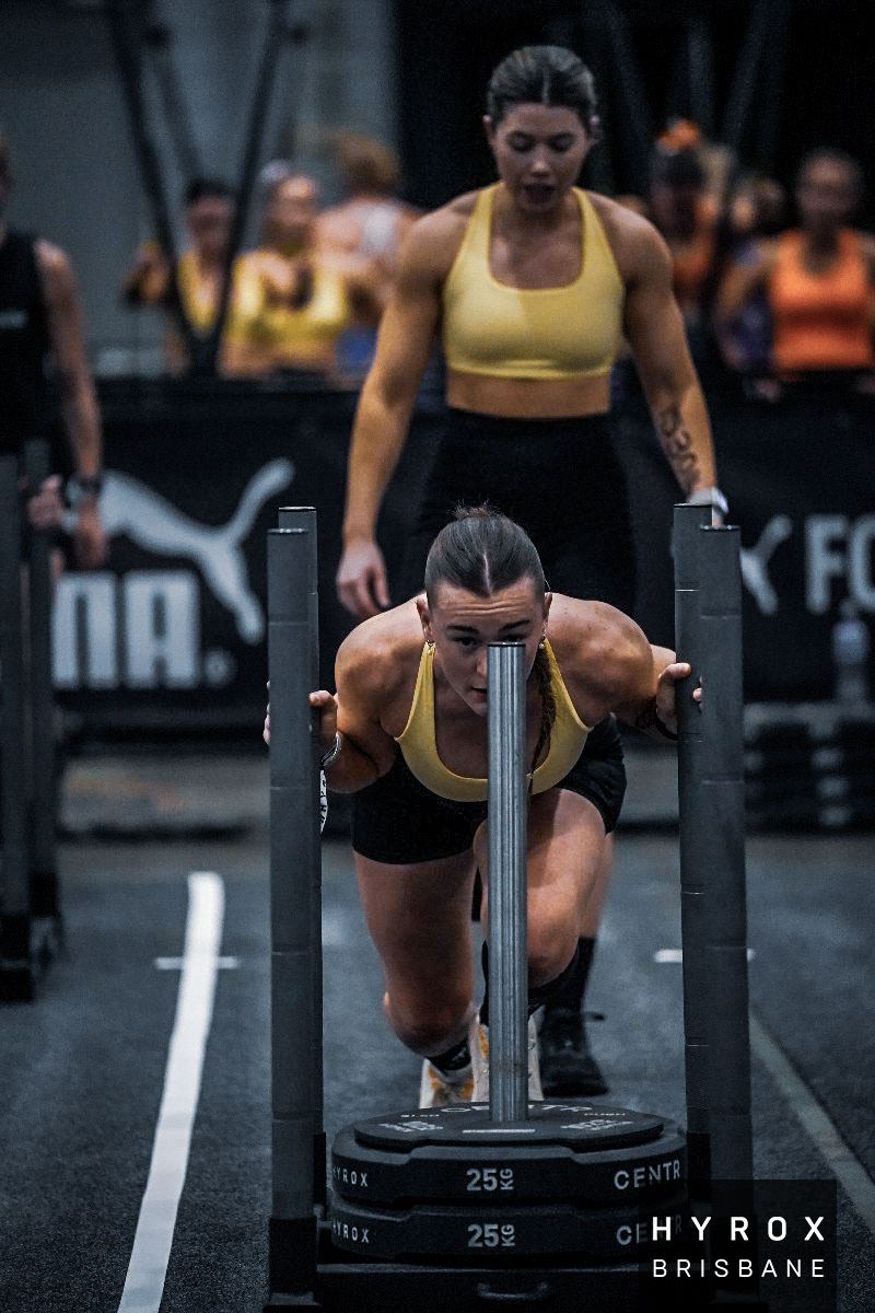 Bekka on the sled push during a Hyrox race